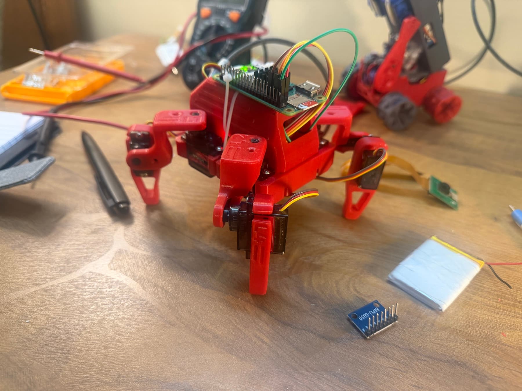 Front view of the red 3D-printed molty quadruped